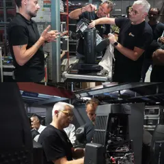 Claypaky specialists demonstrating the internal mechanics of their advanced lighting fixtures to our crew. This in-depth knowledge is crucial for on-set maintenance and performance.