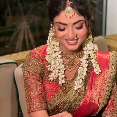 A stunningly beautiful South Indian inspired look from a portfolio shoot. The makeup is soft and glowing, paired with a traditional updo and fresh jasmine flowers.