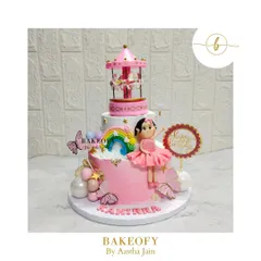 Your wish was my command. This masterpiece for a first birthday features an adorable fondant girl, rainbows, butterflies, and a magnificent carousel on top. It's a 3-tier choco-vanilla delight.