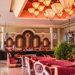 Curiosity peeks through every corner of my crafthouse. The vibrant pink seating, grand bar, and geometric lanterns create an atmosphere where stories lost to time come alive. In every meal, an experience unlike any other becomes yours.
