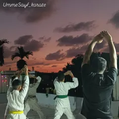 A beautiful evening for some outdoor karate training. Here, we are practicing our warm-up movements together, getting our bodies ready for the session ahead.