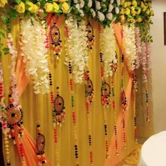 A close-up of decorative hangings used in our backdrops. We use a variety of traditional tassels and ornaments to add detail and color to our fabric drapes.
