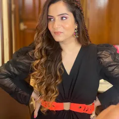 A fun and edgy look for a Super Mario themed birthday party, featuring colorful braids woven into long, flowing curls.