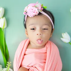 A tiny tongue-out expression. These quirky, fleeting moments are so precious and add so much character to a baby's first gallery.
