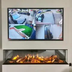 This is the end result of a clean installation: a live multi-camera view displayed seamlessly in a modern living room. We ensure your security system integrates perfectly with your home, allowing you to monitor your driveway, garden, and entrance from one screen.