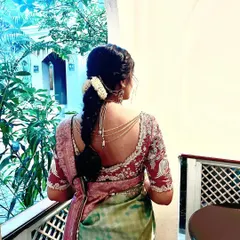 A beautiful back view of this bride's engagement blouse. The intricate embroidery and unique cut are designed to make a statement, even from behind.