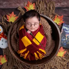 Wingardium Leviosa! Our little wizard is ready for Hogwarts, complete with a Gryffindor scarf, round glasses, a magic wand, and his own Hedwig. A magical theme for any Harry Potter fan.