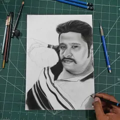The beginning of a commission portrait. I start with a light sketch to get the placement and proportions right before committing to darker shading. This one is laid out on a cutting mat which helps with alignment.