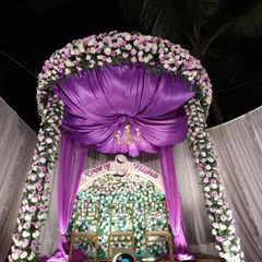A closer look at the magnificent floral canopy for the Roce ceremony. The rich purple draping and dense flower work make this a truly breathtaking centerpiece for the event.