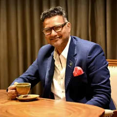 A portrait of Yogi J, the driving force behind our brand. He believes fashion is as much about people as it is about design, focusing on building a team that turns ideas into timeless elegance.