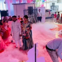 Another view of a baby shower entry I arranged. You can see my team managing the fog machine to create the perfect cloud effect as the couple makes their way to the stage.