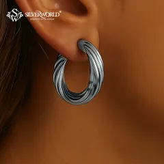 These bold, twisted hoops have an oxidized finish, giving them a contemporary and edgy look. They are substantial yet comfortable to wear.