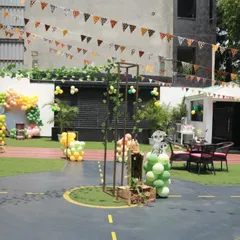 The outdoor area transformed for a Madagascar jungle theme, with animal-print bunting and decorations showing the versatility of the space.
