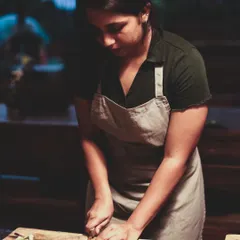 Focus and precision. A student learns the art of chopping, a fundamental skill for any cuisine, during our weekend masterclass.
