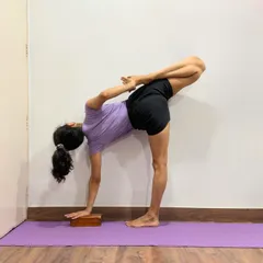 This is Ardha Chandrasana (Half Moon Pose) with the back leg in Padmasana (Lotus Pose). This advanced variation challenges balance and combines a standing pose with a deep hip opener.