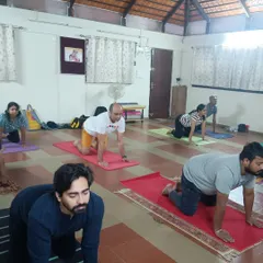 A typical morning class in our Bangalore studio. Participants are seen here in a preparatory posture for Surya Kriya. My focus is always on providing individual corrections and ensuring everyone is aligned correctly to get the most out of their practice.