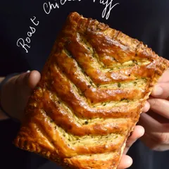 This Roast Chicken Puff is a winter menu favourite. We fill our flaky, all-butter puff pastry with sage and orange roast chicken and a fragrant green garlic butter for a truly comforting bite.
