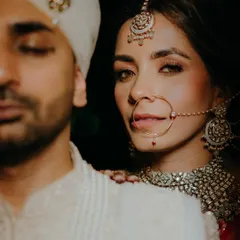 An intimate and artistic bridal portrait that focuses on the bride's expressive eyes and intricate jewelry. We aim to create iconic, magazine-worthy shots that highlight your unique beauty.