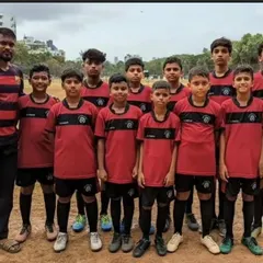 Our Under-13 team stands united with their coach before a match in the MFA Yuva Premier League. This photo represents the discipline, focus, and team spirit we cultivate in our competitive squads.