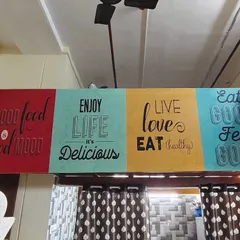 This typography-based wallpaper is great for cafes and restaurants. The colorful panels with positive food-related quotes help create a lively and welcoming dining atmosphere.