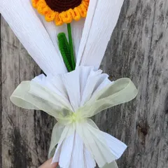 Sometimes, a single flower is all you need to brighten someone's day. This single crochet sunflower is beautifully wrapped to create a simple yet heartfelt bouquet of sunshine for your companion.