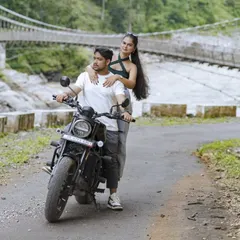 For the adventurous souls, a pre-wedding shoot in the mountains is an unforgettable experience. Here we are in Uttarakhand, using the winding roads and a classic bike to tell a story of a journey they're taking together.