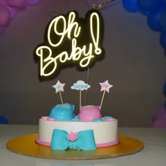 A fun "Oh Baby!" gender reveal cake with a neon sign. We photograph the centerpiece of your baby shower or party.