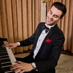 A moment of joy in a perfectly tailored tuxedo. This shot highlights the impeccable fit and the way the fabric moves with you. Whether you're at a piano bar or a wedding reception, my suits are designed to make you feel as good as you look.