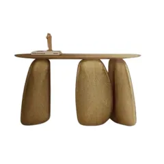 A truly sculptural console table. This piece features a slim wood top balanced on three irregularly shaped, textured gold legs, making it a functional work of art for any entryway.