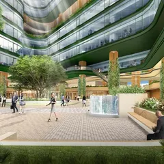 An interior courtyard rendering for the NESCO Centre, showing a vibrant public square with fountains and seating areas. This space is designed to be the social heart of the campus, promoting interaction and community.