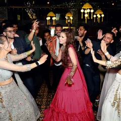 A fun, candid moment of the bride dancing with her friends. These are the pictures that will always make you smile when you look back at your wedding album.
