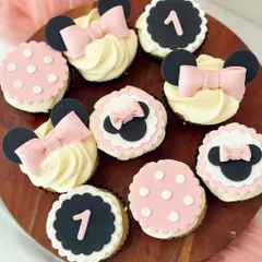 A variation of the Minnie Mouse theme, designed for a first birthday. This set includes pink and white polka-dot toppers, Minnie Mouse silhouettes, and black toppers with the number '1', showing how a theme can be customized for different ages.