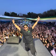 This is the moment it's all about. On my knees, hands up, sharing the energy with thousands of students. An unforgettable moment from my performance at a DU fest.