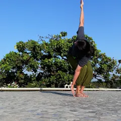 Parivritta Utkatasana (Twisting Chair Pose) is a powerful detoxifying pose that strengthens the legs and core while improving spinal mobility.