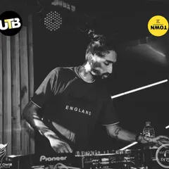 A black and white shot capturing my focus during a techno night. The mood is different, but the goal is the same: create an immersive sound experience.