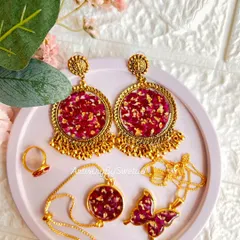 A full set of my real rose petal resin jewelry, including statement earrings, a delicate bracelet, a ring, and a butterfly pendant.
