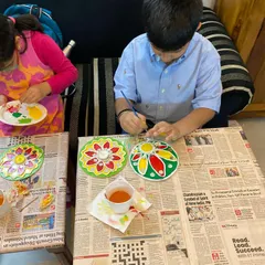 Here are two of my students busy painting their Lippan Art tea light holders for Diwali. It is so rewarding to see them engaged in a traditional art form, using their hands and imagination to create something special.