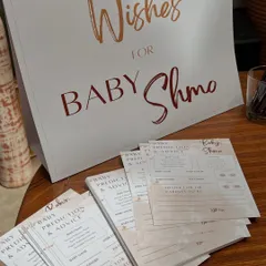We designed custom stationery, including these 'Wishes for Baby Shmo' cards, to create a cohesive and interactive experience for the baby shower guests.