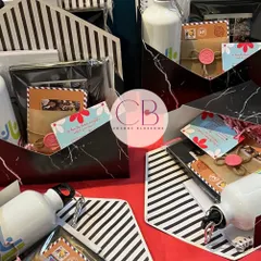 We love creating hampers for colleges and corporate clients. These modern gift boxes were made for MDI Gurgaon and included a customised diary, sipper, photo frame, and postcards.