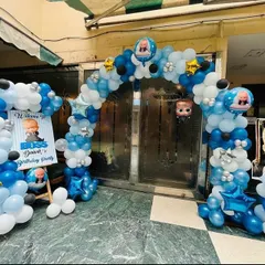 The entrance to this Boss Baby themed party was decorated with a large balloon arch in blue, white, and black. A welcome sign and character cutouts greeted the guests as they arrived.