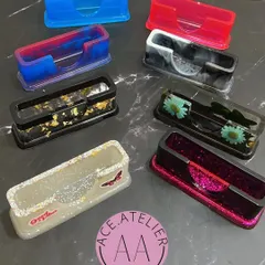 A collection of my custom resin card holders in various colors and styles. They are a stylish and modern alternative to basic card holders.