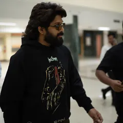 Allu Arjun on the move. The graphic hoodie paired with sunglasses creates an effortlessly cool airport look that’s perfect for a cross-country press tour.