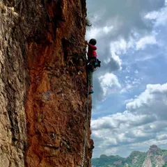 A climber high up on one of the new routes at Talai Betta. The views of the surrounding landscape from this height are absolutely worth the effort.