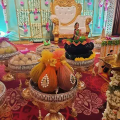 We love getting creative with our doll placements. For this event, we seated a beautifully dressed doll atop a lotus-shaped arrangement of coconuts, making it a unique centerpiece.