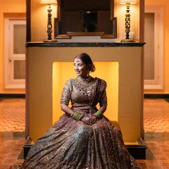 A moment of regal elegance. For her reception, we styled this bride in a timeless, multi-hued Tarun Tahiliani ensemble paired with heritage gold jewelry, creating a look that was different from her red bridal outfit but equally graceful.