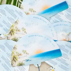 For a destination wedding in Los Cabos, I designed these unique ceremony programs as hand fans. They were perfect for the warm beach setting, featuring a beautiful watercolor of the seaside venue and the full itinerary.