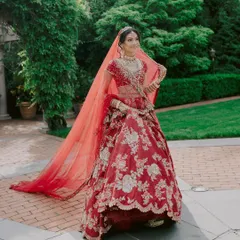 The drama of a long, sheer veil adds a touch of royalty to any bridal look. We chose this stunning red veil from Label Shefali Nangia to complement her intricately embroidered lehenga.
