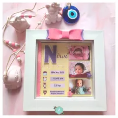A truly special keepsake for a newborn. This custom box frame captures all the important details of baby Nirvi's birth, including her name, birth date, time, and weight, alongside her first photos.