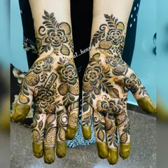 A bold and beautiful design with the name 'Yashfeen' artfully written into the floral pattern on the palm.
