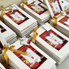 A large order of our "Cars" themed birthday return favour bags, each personalized with the birthday boy's name and age.